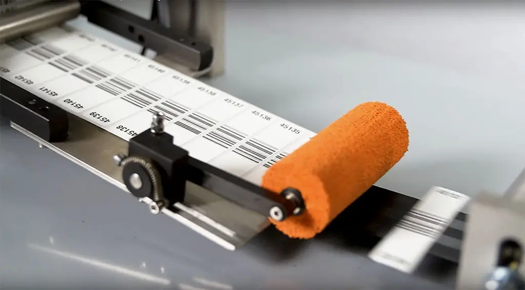 comvis narrow fabric label applicator labels detected defects on textile